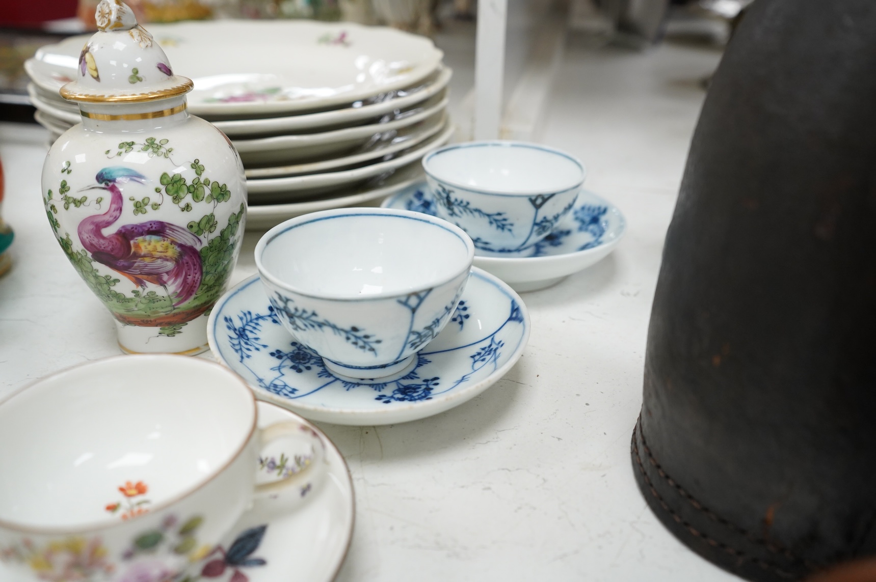 A group of 18th/19th century Continental porcelain, including six 18th century Vienna porcelain plates, a Meissen onion pattern dish, a pair of mid-18th century Meissen teacups and saucers, two tea bowls and saucers and